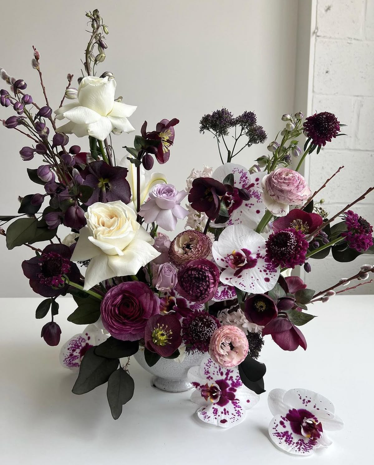 Midnight Garden arrangement with dark blooms and greenery